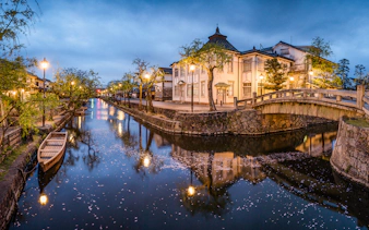 Canal with traditional buildings and bridge in Kurashiki, Japan, part of 7 Day JR Setouchi Area Pass.