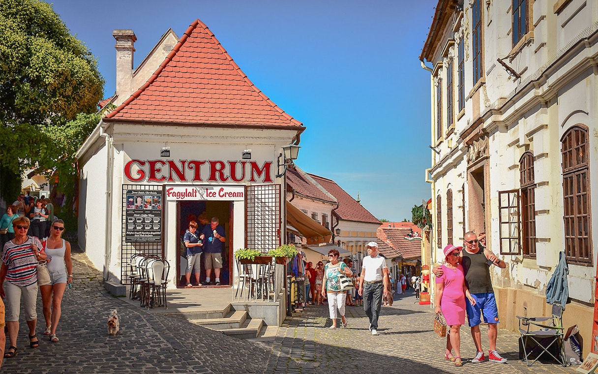Szentendre street scene with tourists near an ice cream shop on a half-day tour from Budapest.