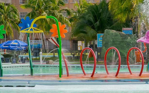 Colorful water play area with fountains at Ehsan Waterpark.