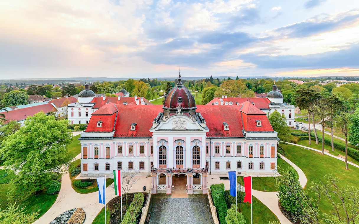Gödöllő Palace with red roof and gardens, Budapest: Royal Sisi Guided Half-Day Tour.