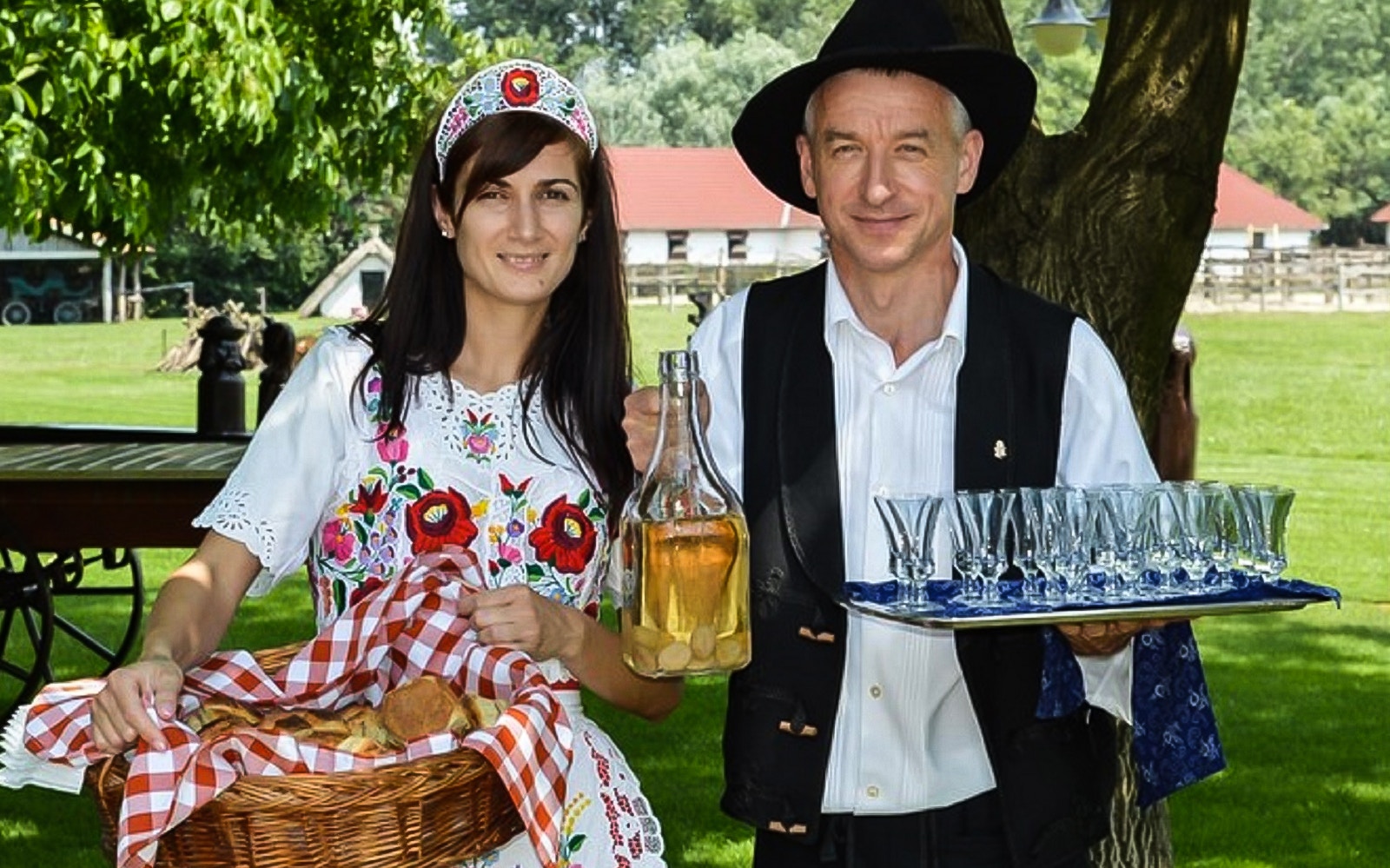 Traditional Hungarian hosts with bread and wine on Puszta Day Trip to Kecskemet from Budapest.