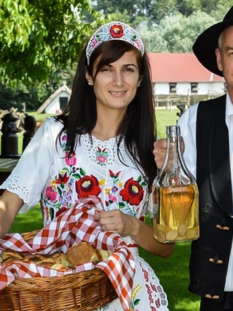 Traditional Hungarian hosts with bread and wine on Puszta Day Trip to Kecskemet from Budapest.