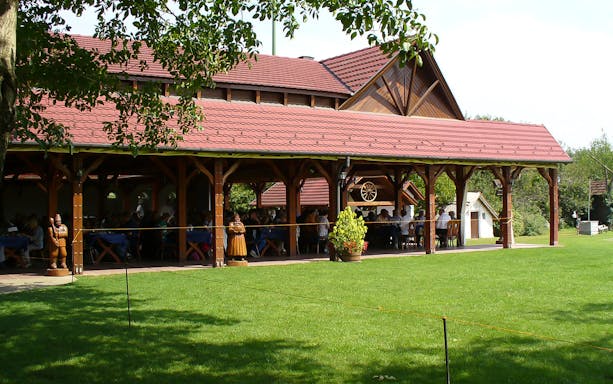 Outdoor dining area at a traditional Hungarian ranch in Kecskemet during Puszta day trip from Budapest.