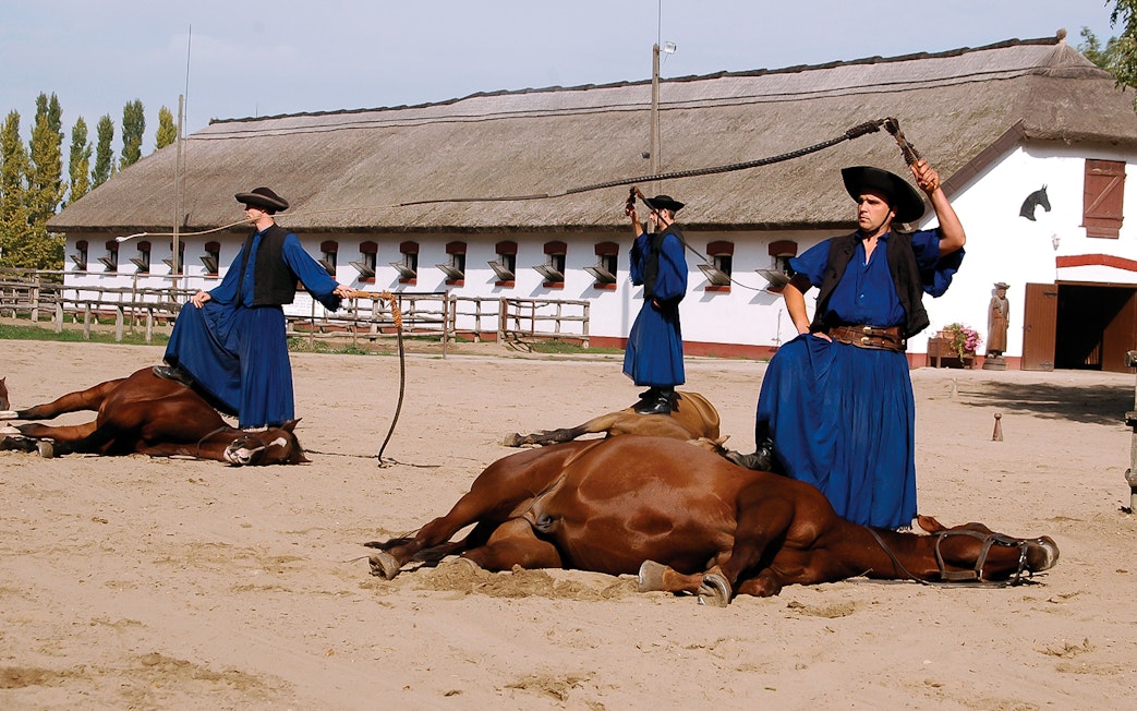 Horsemen performing traditional show in Kecskemet, Hungary during Puszta day trip from Budapest.