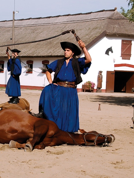 Horsemen performing traditional show in Kecskemet, Hungary during Puszta day trip from Budapest.