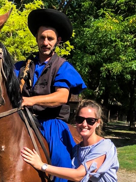 Horseman in traditional attire with tourist during Puszta day trip in Kecskemet, Hungary.