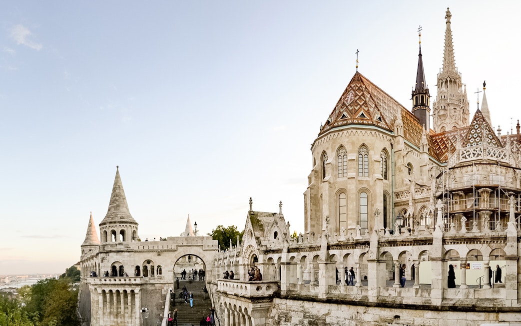 Fisherman's Bastion in Budapest with tourists exploring the historic architecture.