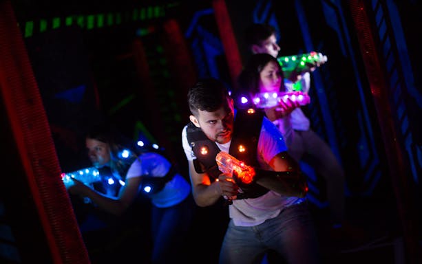 Participants playing laser tag at Laser Quest Bukit Batok.
