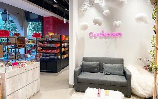 Candle Making Workshops at Candlescape with cozy seating and colorful supplies.