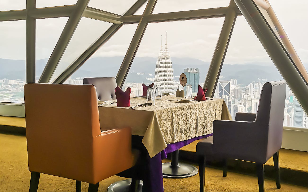 Dinner table set with city view from KL Tower, Kuala Lumpur.