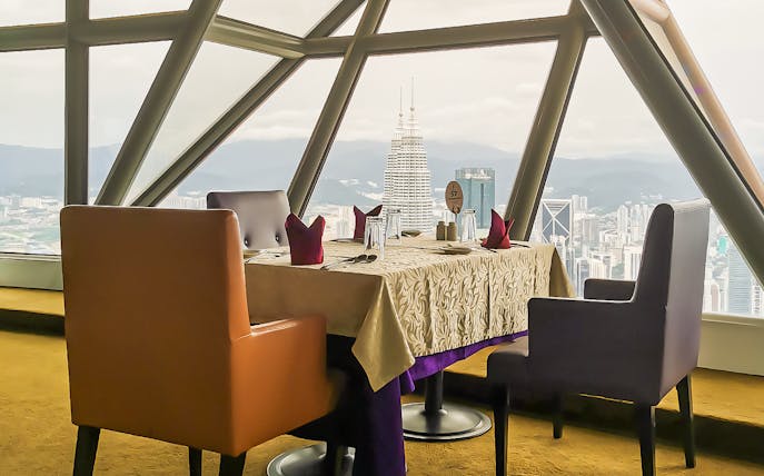 Dinner table set with city view from KL Tower, Kuala Lumpur.