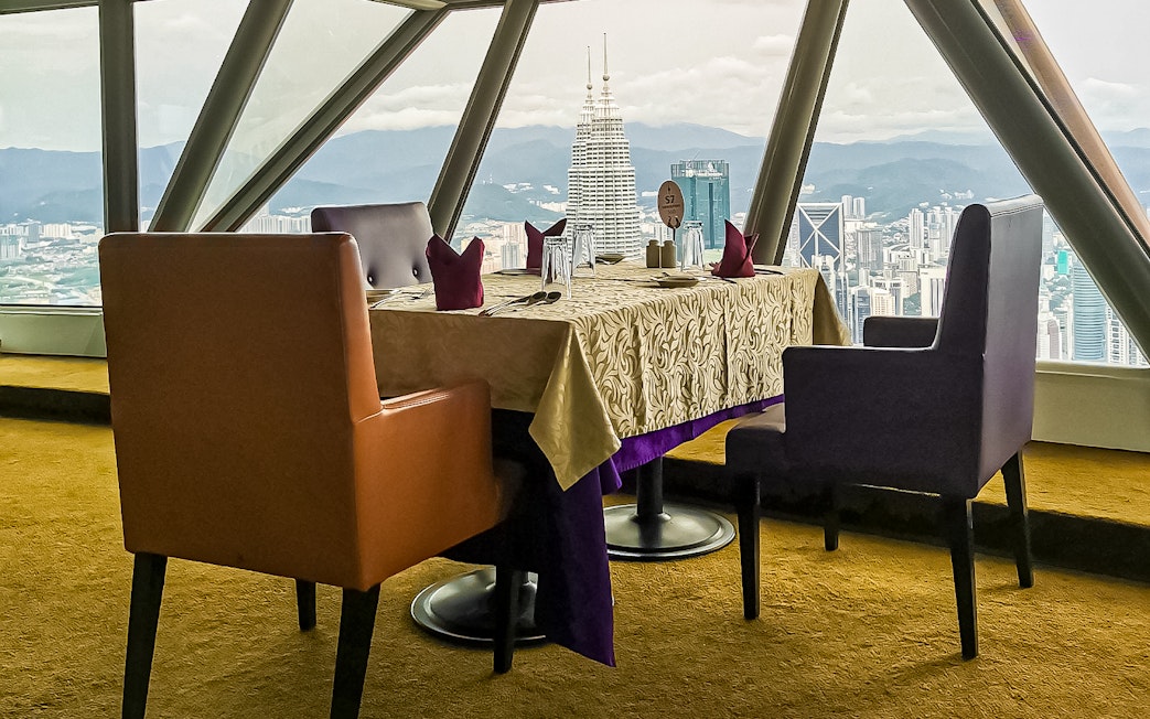 Table with city view at Atmosphere 360 Revolving Restaurant, Kuala Lumpur.