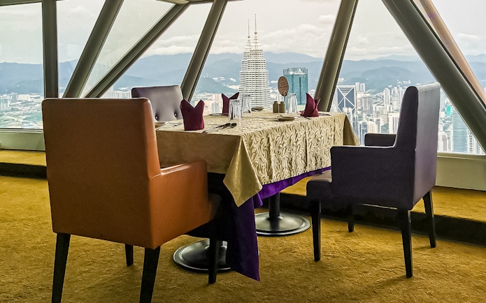 Table with city view at Atmosphere 360 Revolving Restaurant, Kuala Lumpur.
