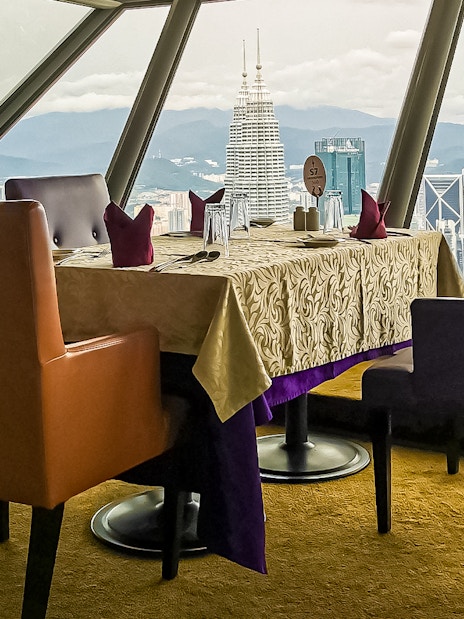 Table with city view at Atmosphere 360 Revolving Restaurant, Kuala Lumpur.
