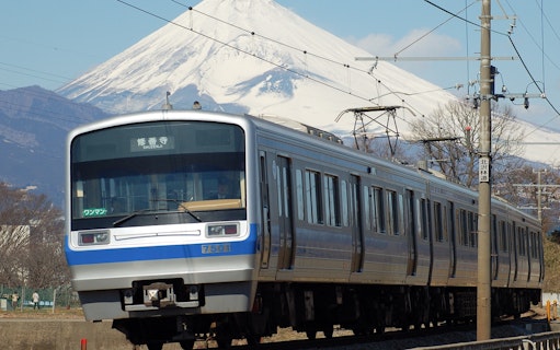 Train on Izuhakone Line with Mount Fuji in the background.