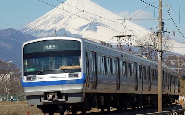Train on Izuhakone Line with Mount Fuji in the background.