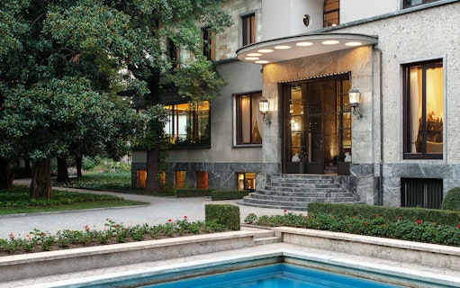 Villa Necchi Campiglio entrance with garden and pool in Milan, Italy.