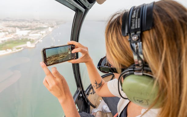 Helicopter view of Lisbon coastline during 360º Lisboa SkyWalk tour.