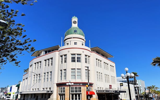 Art Deco building with clock tower in Napier, New Zealand, on the Half-Day Best of Napier and Hawkes Bay Tour.