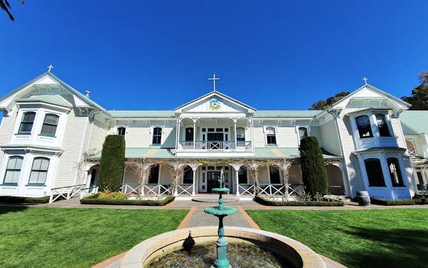 Historic building with a fountain in Hawkes Bay, New Zealand, part of A Grand Day Out tour.