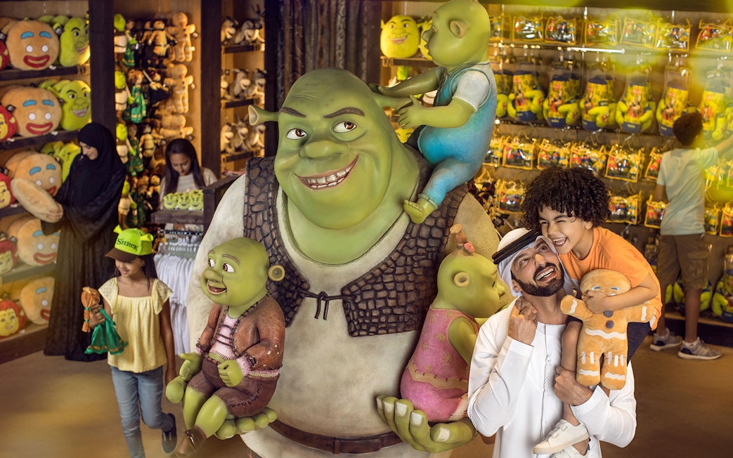 Family enjoying Shrek store at MOTIONGATE Theme Park, Dubai Parks and Resorts.