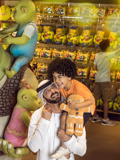 Family enjoying Shrek store at MOTIONGATE Theme Park, Dubai Parks and Resorts.