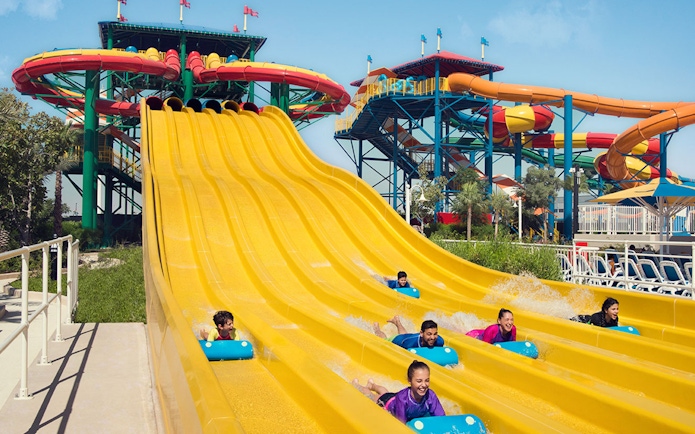 Visitors enjoying water slides at Dubai Parks and Resorts.