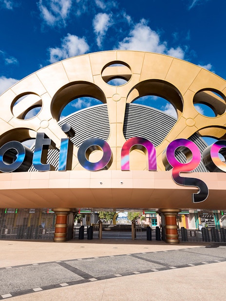 Entrance to MOTIONGATE Theme Park with iconic film reel design.