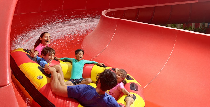 Family riding the Red Rush water slide at LEGOLAND Water Park.