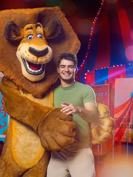 Characters from Madagascar with visitors at MOTIONGATE Theme Park, Dubai Parks and Resorts.