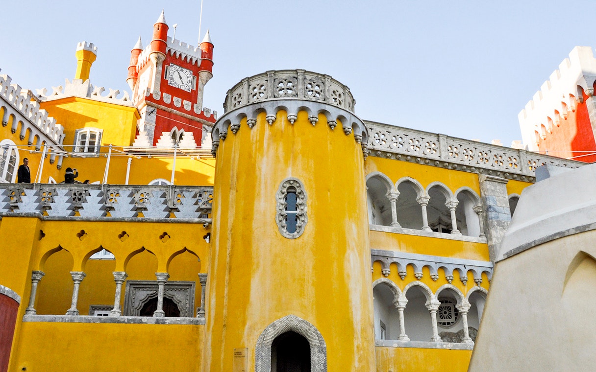 Pena Palace's colorful facade in Sintra, Portugal, seen on a full-day tour from Lisbon.