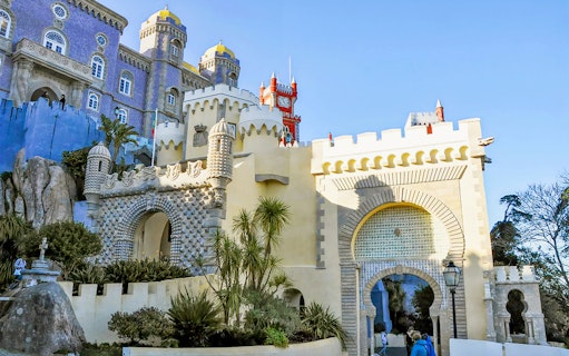 Pena Palace entrance in Sintra, Portugal, showcasing colorful architecture on a full-day tour from Lisbon.