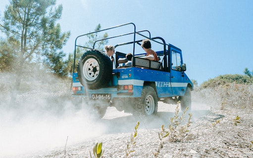 Jeep driving through Sintra countryside on guided safari tour from Lisbon.