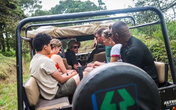 Jeep safari group exploring Sintra's lush landscape on a guided tour.