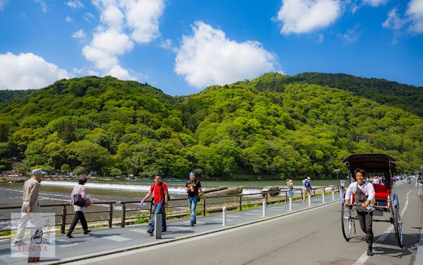 Rickshaw ride through bamboo forest in Arashiyama, Kyoto, Japan.