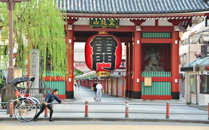 Rickshaw puller in front of Kaminarimon Gate, Asakusa, Tokyo.