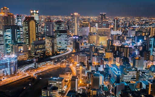 Tokyo cityscape at night with illuminated skyscrapers, highlighting connectivity for Billion Connect Japan eSIM.