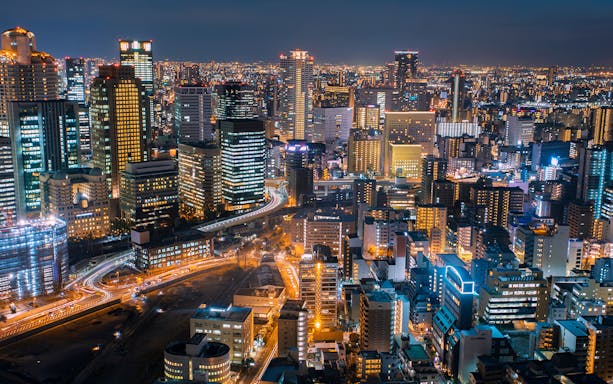 Tokyo cityscape at night with illuminated skyscrapers, highlighting connectivity for Billion Connect Japan eSIM.