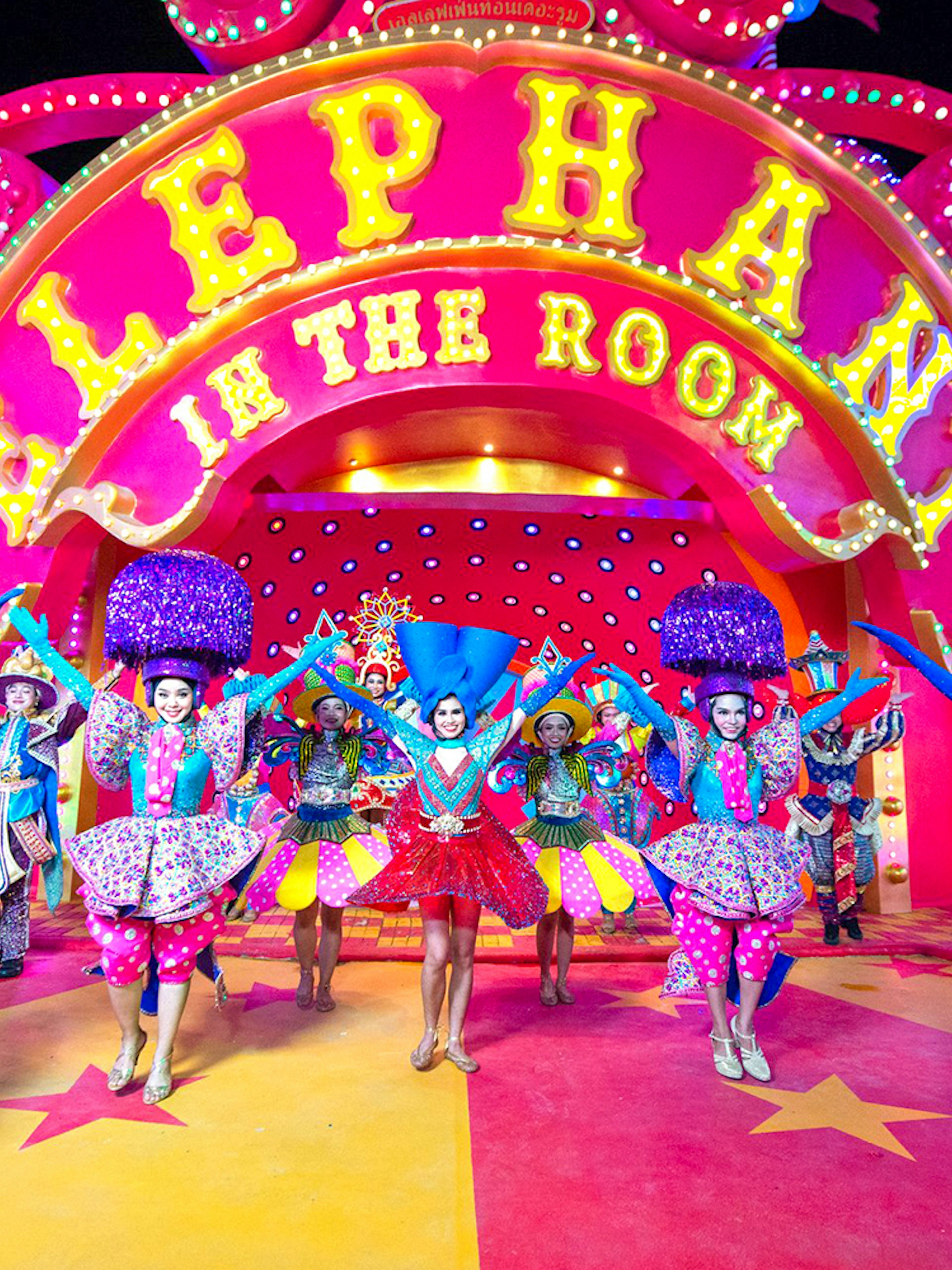 Performers in colorful costumes at Carnival Magic Phuket, Thailand.