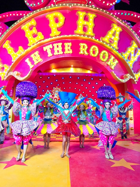 Performers in colorful costumes at Carnival Magic Phuket, Thailand.