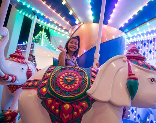 Carnival Magic Park entrance in Phuket with vibrant lights and decorations, dinner and transfer options available.