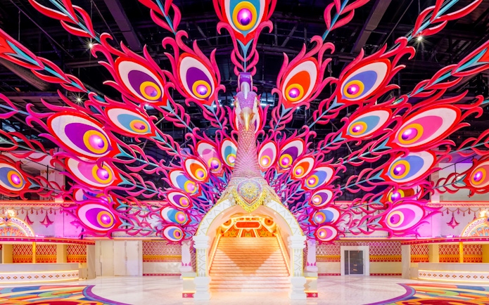 Peacock-themed entrance at Carnival Magic Park in Phuket.
