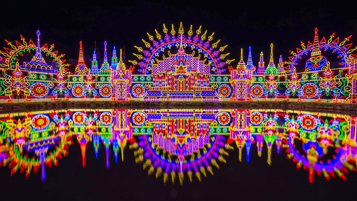 Phuket Carnival Magic Park vibrant parade with performers in colorful costumes.