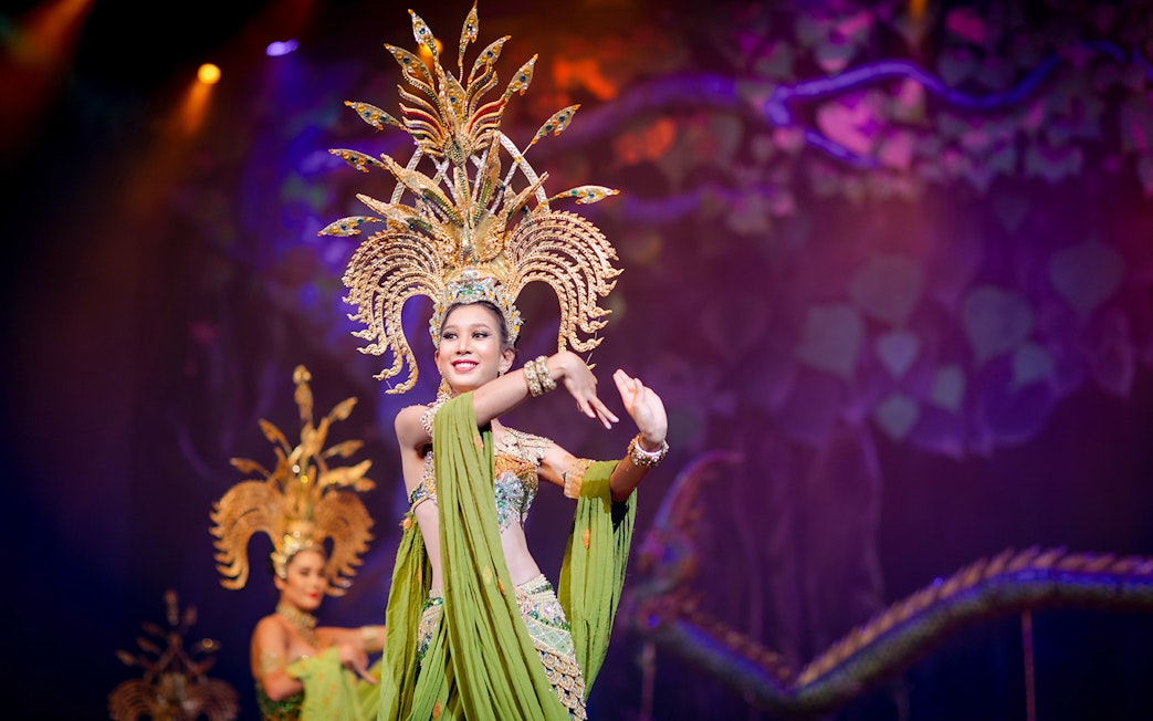 Performer in elaborate costume at Alcazar Cabaret show, Pattaya.
