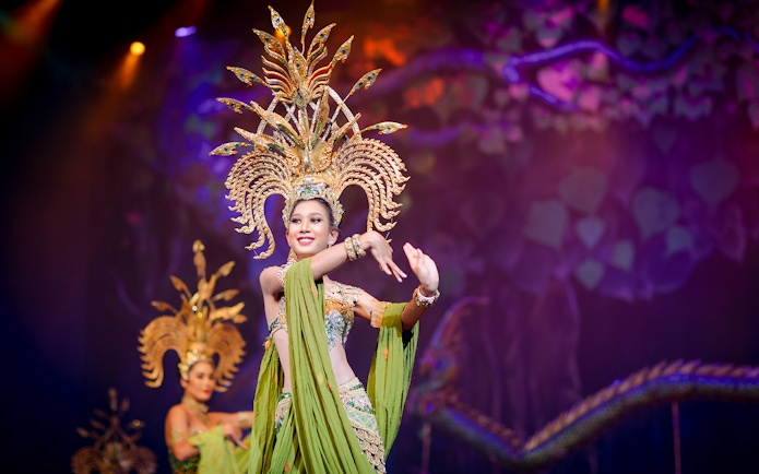 Performer in elaborate costume at Alcazar Cabaret show, Pattaya.