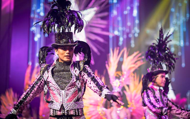 Performers in vibrant costumes at Alcazar Cabaret Show, Pattaya.