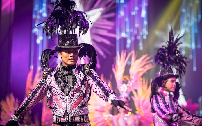 Performers in vibrant costumes at Alcazar Cabaret Show, Pattaya.