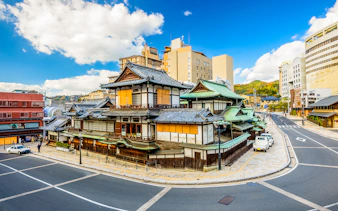 Dogo Onsen Honkan in Matsuyama, Japan, viewed from the street, part of JR All Shikoku Rail Pass tour.