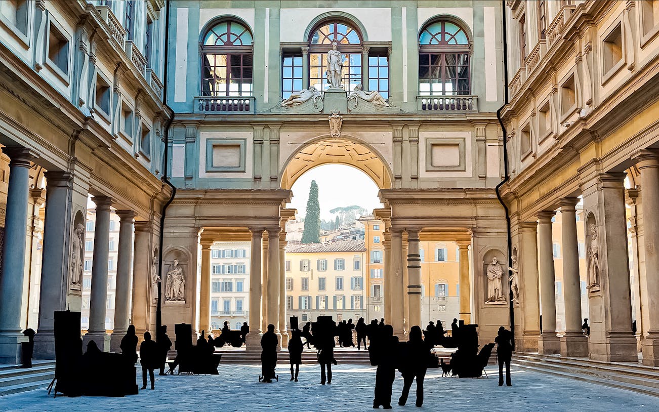 Uffizi Gallery courtyard with visitors, Florence, Italy.