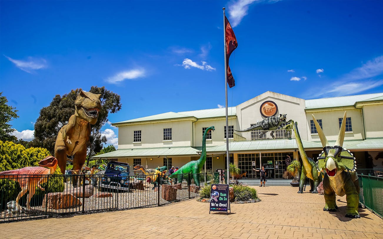 National Dinosaur Museum entrance with dinosaur sculptures, Canberra, Australia.